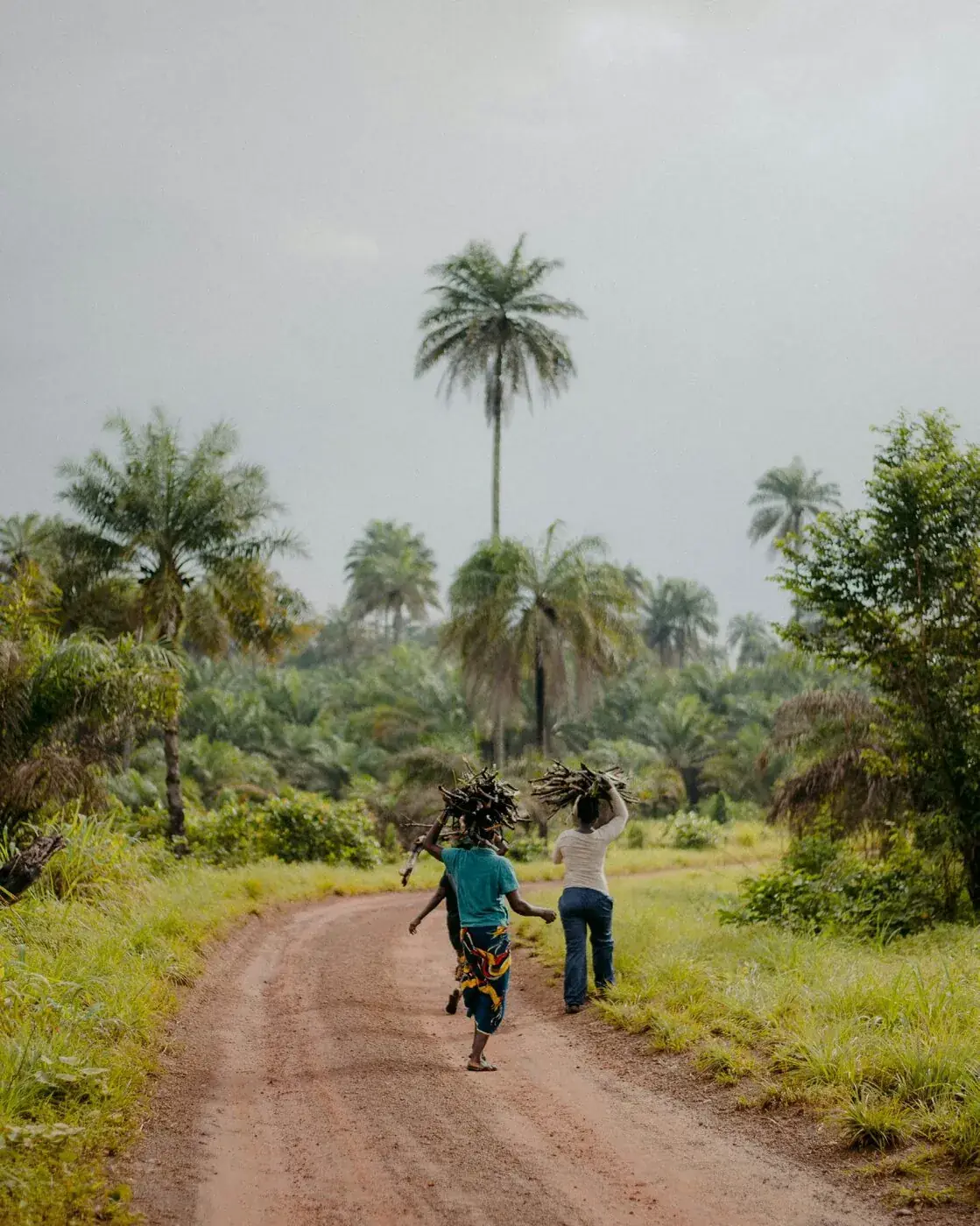 Children running down a village road
